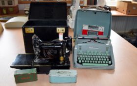 A Vintage Typewriter And Singer Sewing Machine Each in original boxes.