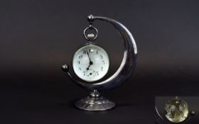 A Good Quality Antique Silver Plated Glass and Ball Desk 8 Day Clock,