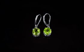 Pair of Peridot Solitaire Drop Earrings, a solitaire, round cut, bright peridot of 2.