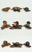 A Small Collection of 19th Century Black Forest - Well Carved Wooden Inkwells with Walnut and Leaf