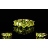 Peridot Five Stone Ring, a 1.25ct centra