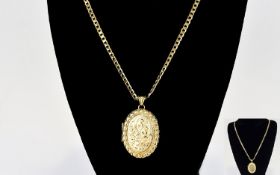 A Very Nice Quality 9ct Gold Oval Shaped Hinged Locket with Attached Long 9ct Gold Curb Chain. The