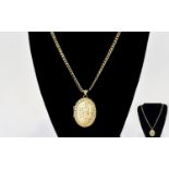 A Very Nice Quality 9ct Gold Oval Shaped Hinged Locket with Attached Long 9ct Gold Curb Chain. The