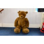 Giant Seated Plush Teddy Bear Large pale brown fur bear toy, with glass eyes.