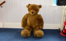 Giant Seated Plush Teddy Bear Large pale brown fur bear toy, with glass eyes.