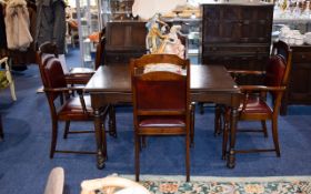 Dark Oak Extending Dining Table And Six Chairs Of plain form with dark, aged patina.