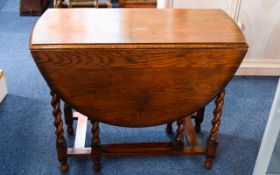 Aged Oak Pembroke Table Drop leaf table with barley twist legs and aged patina.