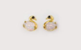 Opal and Black Spinel Swan Stud Earrings, the body of each swan made up of a pear cut cabochon opal,