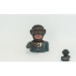 Vintage 'Blackamoor' Money Box Cast iron money box, raises hand to place coin in mouth.