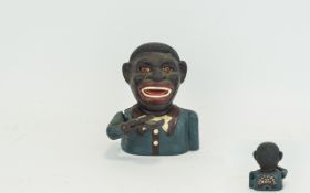 Vintage 'Blackamoor' Money Box Cast iron money box, raises hand to place coin in mouth.