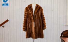 Mink Coat Heavy weight vintage mink coat in golden tone with chevron detail to arms.