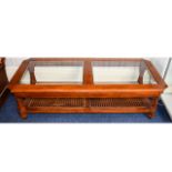 Coffee Table Large low rectangular coffee table in dark wood with bevelled glass top and woven cane