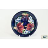 Moorcroft 'Orchid' Pattern Shallow Dish, red and yellow orchids with some green and purple, and
