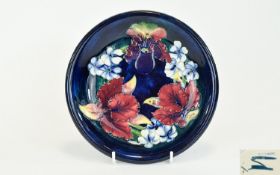 Moorcroft 'Orchid' Pattern Shallow Dish, red and yellow orchids with some green and purple, and