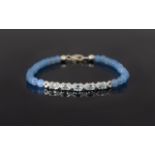 Sky Blue Topaz and Quartzite Bracelet, five oval cut sky blue topaz set in a silver millgrain curved