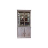 Contemporary Display Cabinet Corner cabinet in pale grey/peach tone wood with two glass front doors,