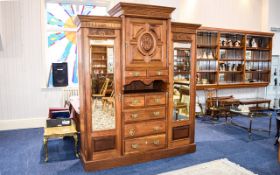 A Large Decorative Two Door Wardrobe Of solid construct with carved detail throughout.