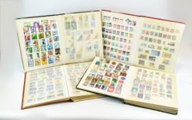 Collection Of Four Stamp Albums, Some Early 20thC, But Mostly A Mixed Lot Of Modern World Stamps.