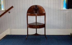 George III Mahogany Corner Washstand. Shaped gallery top over two tiers raised on splayed legs.