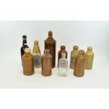 Collection Of Mostly Stoneware Advertising Bottles To Include John Baxter Ltd Waterfoot,