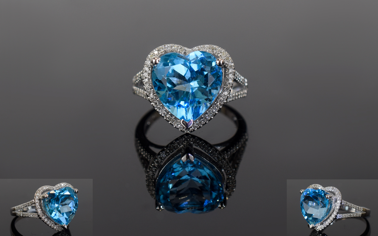 14ct White Gold Diamond & Topaz Ring, Central Heart Shaped Blue Topaz (Approx 6.75cts) Surrounded By