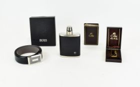 A Boxed Brand New Hugo Boss Belt Along with A Vintage Colibri Lighter And Stainless Steel Hip Flask
