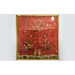 Framed And Glazed Chinese Silk Panel, Embroidered Decoration Depicting Dragons. 35 x 32 Inches