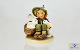 Hummel Figure 'Playmates' Goebel West Germany figure of small boy in Tyrolean dress with a basket of