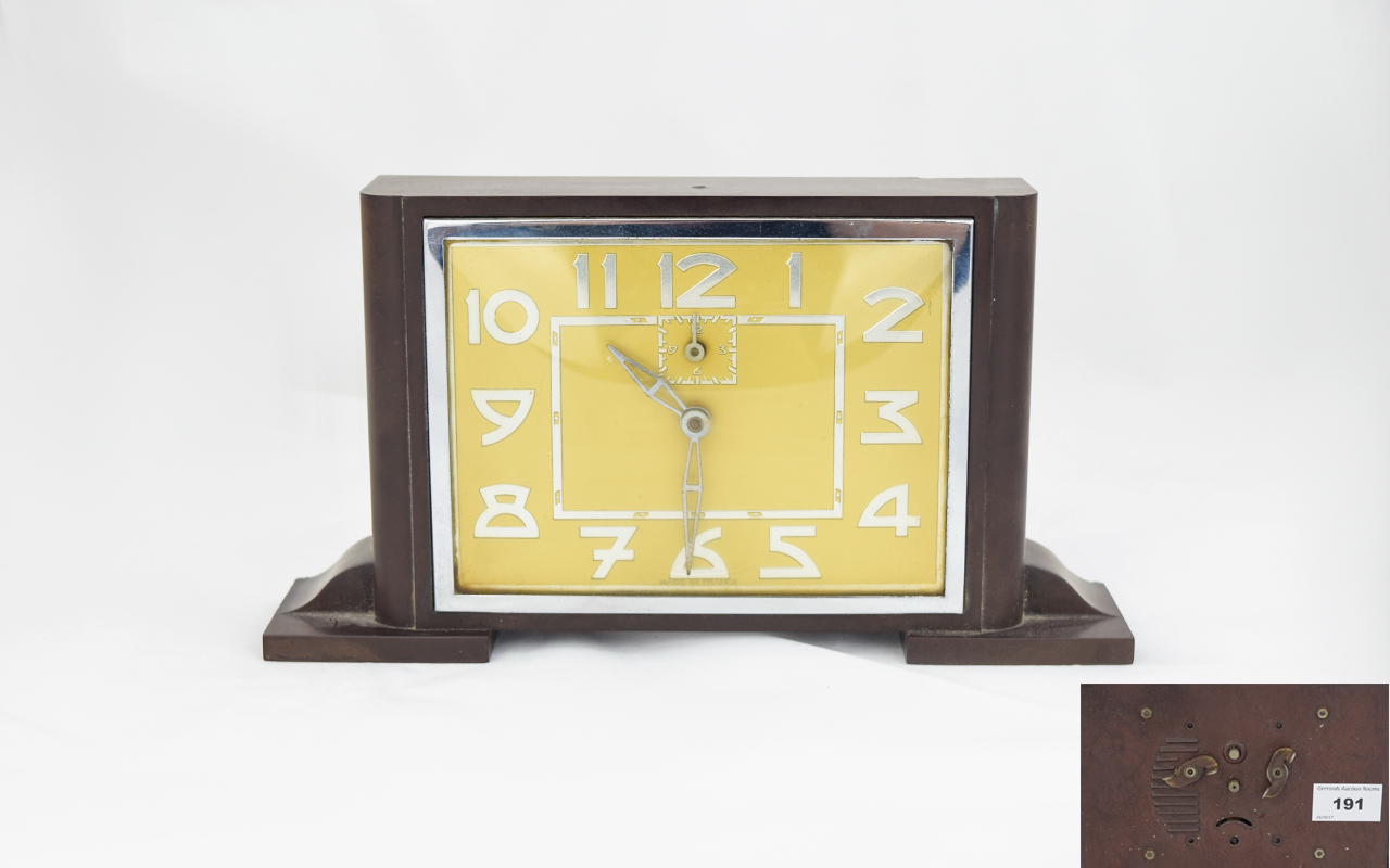 Art Deco Period Bakelite Mantel Clock with Alarm Facility. Features a Yellow Dial with Overlaid
