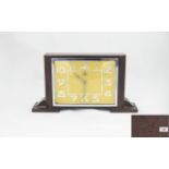 Art Deco Period Bakelite Mantel Clock with Alarm Facility. Features a Yellow Dial with Overlaid