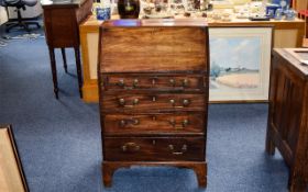 Dark Oak Bureau Small bureau with aged patina and four drawers with brass pull handles.