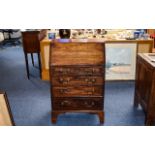 Dark Oak Bureau Small bureau with aged patina and four drawers with brass pull handles.