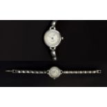 A Ladies Jane Shilton Wrist Watch With faux mother of pearl dial