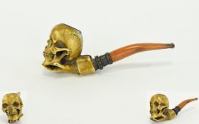 Antique Opium Pipe, with an Amber Stem, The Bowl In The Form of a Skull Being Held by a Hand. Size -