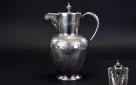 A Silver Plated Water Jug/Carafe Late 19th Century water vessel in neoclassical style with floral