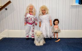 A Collection Of Dolls Four items in total to include two large jointed plastic dolls one small
