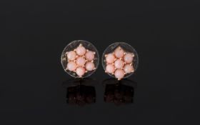 Pink Opal Flower Stud Earrings, each earring comprising seven round cut natural pink Peruvian opals,