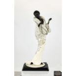 Italian Elegant Figure of a lady in evening dress by the Italian designer 'DEAR'. Hand decorated and