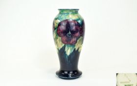 Moorcroft 'Pansy' Baluster Vase, deep blue ground to the lower part, mottled teal and cream to the