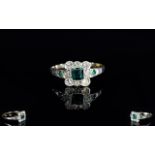 A Ladies 9ct Gold Emerald And Diamond Cluster Ring Fully hallmarked for 9ct, the central emerald