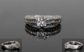 Fine Quality White 18ct Gold Set Single Stone Princess Cut Diamond Ring with Diamond Shoulders.