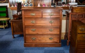 Large Dark Wood Chest Of Drawers Of plain form with five drawers and brass pull handles.