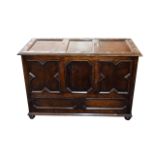 Large Antique Oak Coffer Bedbox/coffer in dark oak with carved fan shaped design top.