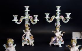 Meissen Fine Pair of Porcelain Figural - 4 Branch Candelabra, Decorated with Images of Winged