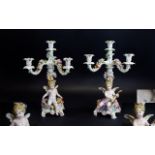 Meissen Fine Pair of Porcelain Figural - 4 Branch Candelabra, Decorated with Images of Winged