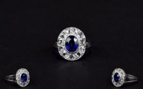 Ladies 18ct White Gold Diamond Cluster Ring Set With A Central Blue Sapphire Surrounded By Eleven