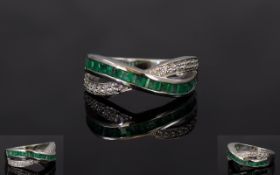 Emerald and Natural White Zircon Cross Band Ring, a row of channel set,