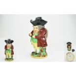 Staffordshire Early 19thC 'Snuff Taker' Toby Jug, the gentleman wearing a maroon coat, green