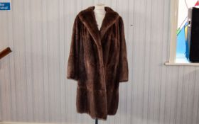 Vintage Mid Length Musquash Coat Ladies shawl collar coat in pale brown mink with side seam pockets,