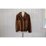 Mink Jacket Ladies vintage mink short jacket in golden brown fur with revere collar and side seam